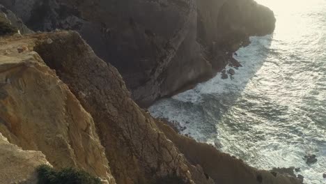 aerial-shot-fly-up-over-cliff,-sesimbra