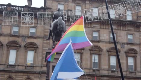 A-slow-motion-and-close-up-of-a-rainbow-flag-and-the-Saltire-flying-together