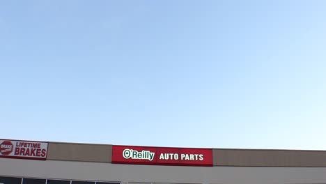 O'Reilly-Auto-Parts-Store-Wide-Establishing-Shot-Pan-Down-From-Sky
