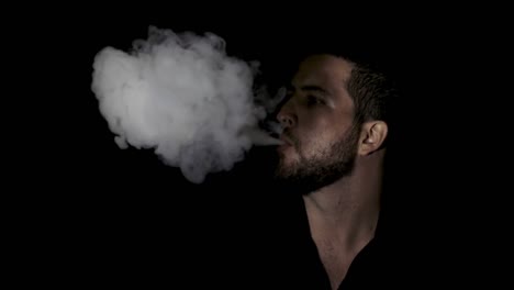 Slow-motion-close-up-smoking-man-on-black-background