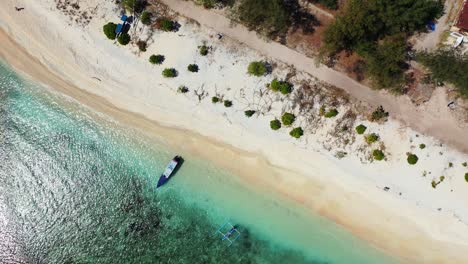Top-down-view-of-amazing-shoreline-of-tropical-island-with-secluded-exotic-beach-washed-by-calm-clear-turquoise-lagoon-in-Philippines