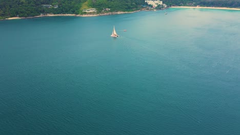Drone-footage-aerial-top-view-of-catamaran-sailing-in-the-open-sea