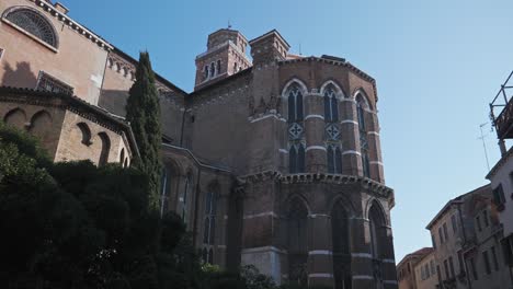 Medieval-architecture-of-Basilica-di-Santa-Maria-Gloriosa-dei-Frari,-antique-church-in-Venice,-northern-Italy,-Low-angle-shot