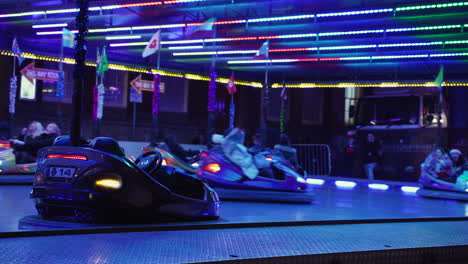 Flashing-neon-lights-and-cars-spinning-and-smashing-into-others-in-a-bumper-car-ride