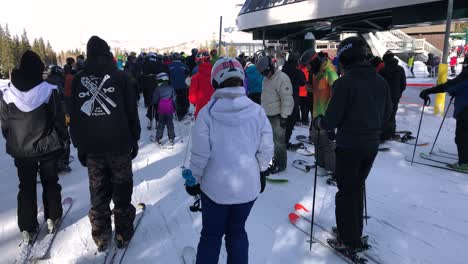Large-crowds-of-people-waiting-in-line-at-Brighton-Ski-Resort-in-Utah,-Hand-held
