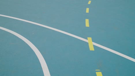Pan-over-lines-on-ground-on-an-outdoor-sport-court
