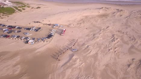 Aerial-top-down-of-Desert-Camel-Rides-attraction-and-sand-dunes-at-Anna-Bay