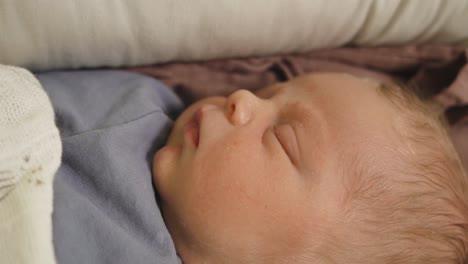 New-born-european-baby-sleeping-eyes-moving-when-dreaming-tight-close-up