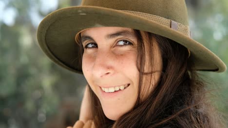 Close-up-of-young-woman-with-a-hat,-smile-feel-happy,-female-model-outdoors-portrait