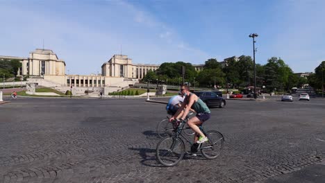 Warsaw-place-near-trocadero-in-Paris-during-calm-summer-day-after-covid-lockdown-with-few-cars-and-bike-cycling-around,-wide-panning-shot
