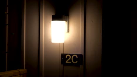 House-number-2C-under-a-light-at-night
