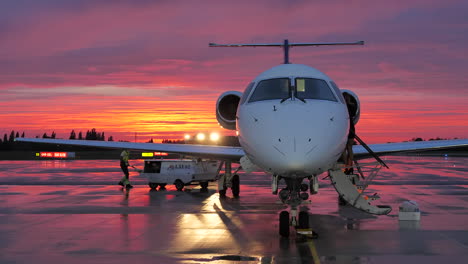 Embraer-aircraft-prepared-for-flight-in-beautiful-sunset