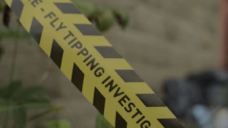 Illegal-fly-tipping-waste-investigation-tape-close-up-shot