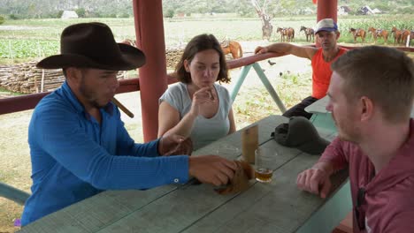 Local-Cuban-Man-Showing-Tourists-How-To-Make-Cigar