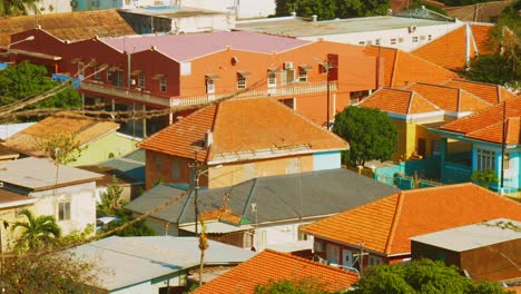 Red-Tiled-Rooftops-Of-Houses-And-Buildings-IN-Willemstad,-Curacao-On-A-Sunny-Day