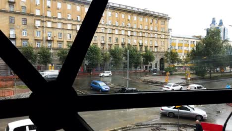 Saint-Nicholas-Chappelle-in-Novosibirsk-city,-Russia,-from-inside-building-view-in-motion-time-lapse-shot-with-hight-traffic-and-people-walking