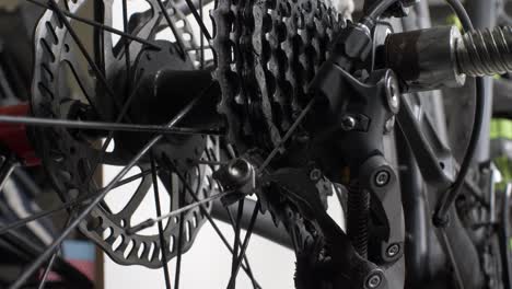 Low-Angle-View-Of-Slow-Spinning-Rear-Bike-Cassette-On-Hub-With-Disc-Brake