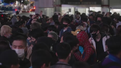 Busy-Crowd-Moving-Around-With-Masks-And-Costumes-At-Shibuya-Crossing-On-Halloween-Night-In-Tokyo,-Japan---Medium-Shot