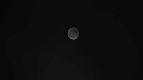 Wide-shot-of-full-moon-as-it-is-slowly-covered-with-passing-fog