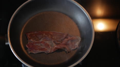 Cooking-Bacon-Slice-In-A-Hot-Skillet---overhead-shot,-timelapse
