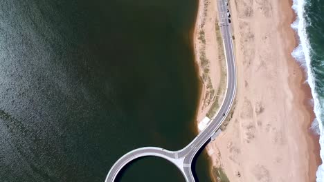 Drone-surveying-a-bridge-of-the-in-Garzon,-Maldonado,-Uruguay