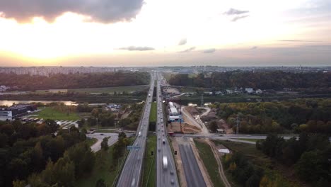 The-A1-highway-bridge-over-river-Neris-in-Kaunas,-Lithuania-in-drone-aerial-time-lapse