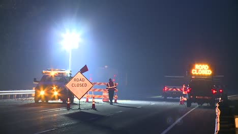 ROAD-CLOSED-CONSTRUCTION-WORKERS-AT-NIGHT