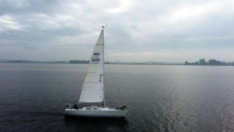 Following-a-sailboat-with-a-drone-on-the-side