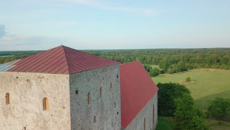 Aerial-of-an-ancient-Christian-church-in-Estonia,-Saaremaa