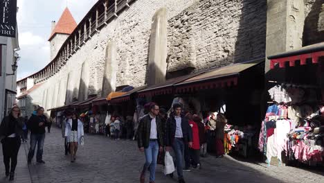 A-market-stalls-near-the-castle-wall-in-Tallinn,-Estonia