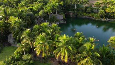Aerial-view-of-a-tiki-next-to-a-lake-on-a-sunny-and-beautiful-afternoon-in-South-Florida