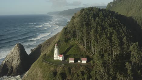 Wide-circumnavigating-aerial-revealing-Haceta-Head-lighthouse-in-Oregon