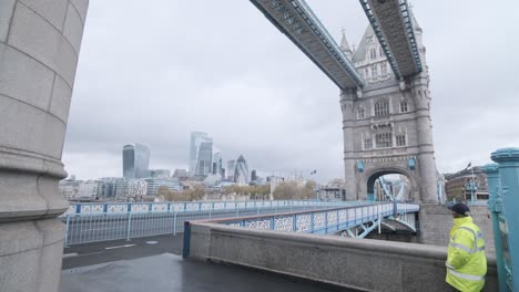 Wide-shot-of-empty-tower-bridge-London-on-a-rainy-cloudy-day-covid-19-lockdown-UK