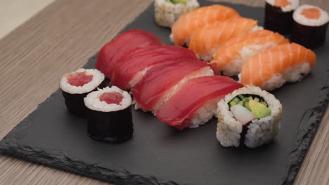 Sushi-assortment-with-nigiri-salmon,-nigiri-tuna,-hosomaki-and-uramaki