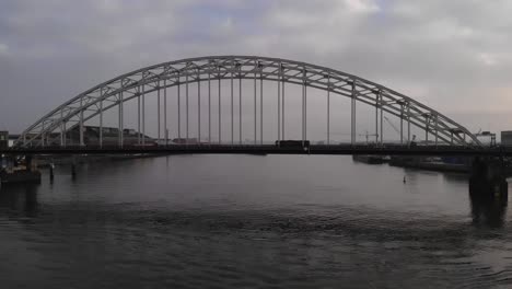 Vehicles-Crossing-The-Arch-Bridge-Over-Noord-River-In-Alblasserdam,-Netherlands
