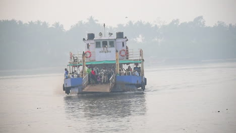 A-Ferryboat-arrived-on-jetty-or-dock-with-full-of-passengers-starting-to-departure-on-platform-video-background-in-pro-res-422-HQ