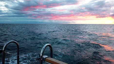 Magnificent-Sunset-Sky-Viewed-From-A-Cruising-Yacht-In-Madeira-Island,-Portugal,-wide-shot,-POV