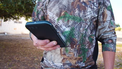 Hunter-looking-at-cell-phone