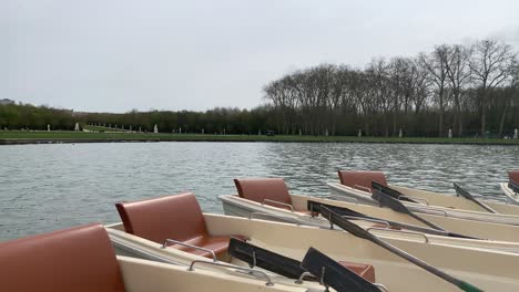 Different-views-of-the-bobbing-boats-on-the-Fountains-of-Versailles,-next-to-the-Palace-of-Versailles