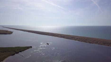 Aerial-tracking-from-left-to-right-above-the-fleet-lagoon-at-Chesil-Beach