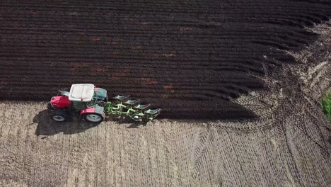 Aerial-footage-over-tractor-ploughing-field