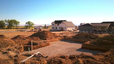 A-drone-shot-push-in-on-a-recently-dug-hole-ready-for-a-new-house-to-be-built