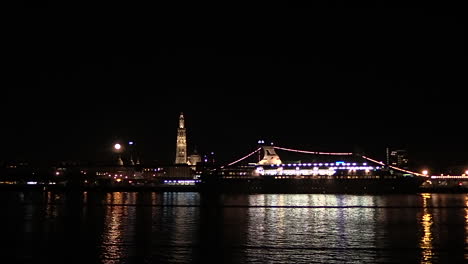 panoramic-view-of-Antwerp-cityscape-over-Scheldt-river-at-a-full-moon