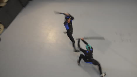 High-angle-two-shot-of-actors-in-MoCap-suits-doing-a-choreographed-sword-fight