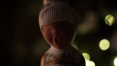 Small-statue-and-christmas-tree-at-Christmas-eve-Recorded-with-a-Sony-A7-III-in-4K-30fps
