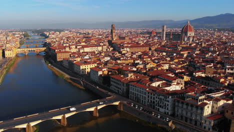 Aerial-view-of-Arno-river-and-the-city,-in-the-morning,-Florence,-Italy