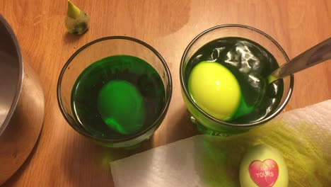 Dipping-and-dying-eggs-light-green-for-Easter