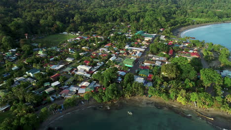 Aerial-video-from-the-caribean-sea-approaching-the-city-in-Puerto-viejo,-Costa-Rica