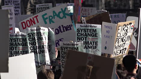 UK-February---Placards-that-say,-“System-change-not-climate-change”-move-around-on-a-climate-change-protest