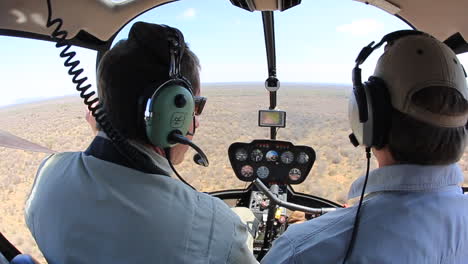 A-group-of-conservationists-fly-in-a-Robinson-44-over-the-Madikwe-Private-game-reserve-in-search-of-White-and-Black-rhino-to-dart-in-a-conservation-effort